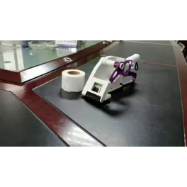 HAND-HELD LABEL APPLICATOR