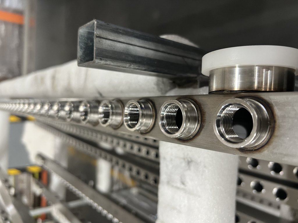 AUTOMATED ROBOTIC LASER WELDING CELL FOR LIQUID-COOLED MANIFOLDS IN COMPUTING DATA CENTERS